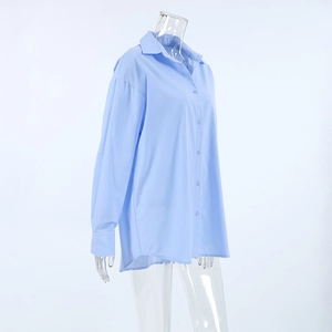 Close-up of light blue cotton linen shirt with pointed collar and buttoned cuffs