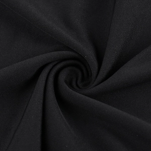 Detailed macro shot of premium black mesh fabric texture with elegant draped silk ribbon