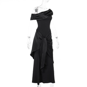 Detailed view of the elegant satin knot and draped pleats on the black mesh maxi dress