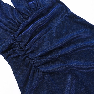 Close-up of deep blue metallic knit fabric with elegant pleated ruching and shiny texture