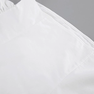 Detailed close-up showing precision stitching and fabric texture on white cotton vest