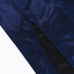 Close-up of shimmering dark blue fabric texture and split hem design with black lining