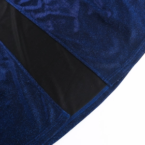 Detail of glittery navy blue fabric with high-quality overlock stitching on seam
