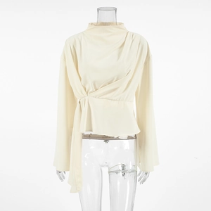 Detail view of apricot chiffon blouse featuring elegant high neck and twisted waist ties