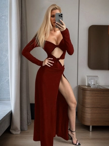 Detail of elegant wine red dress featuring sexy cut-outs and high side slit design