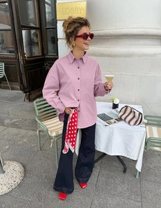Close-up of a pinkish-purple oversized cotton shirt with a single pocket and polka dot scarf