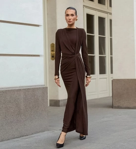 Detail of elegant dark brown long-sleeved dress with waist knot and drapes