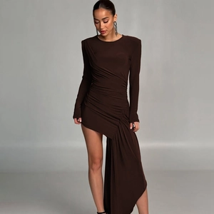 Detail of slim-fit dark coffee dress featuring ruching waist and asymmetrical layered hem