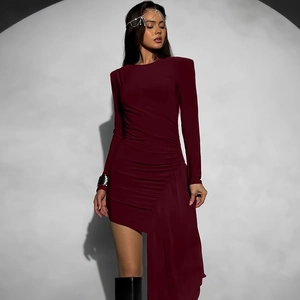 Detail of burgundy ruched waist dress with long streamers and asymmetrical hemline
