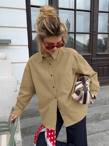 Women's khaki cotton utility shirt with lapel and breast pocket in loose casual style