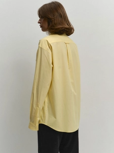 Women's loose light yellow cotton shirt with classic collar and back pleat detail