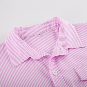 Detail of pink striped shirt with button, front pocket and collar size label M