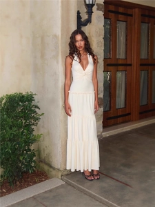 Elegant cream halter neck maxi dress with deep V-neck twist knot and layered cake skirt