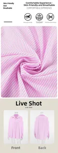 Detail of pink striped cotton shirt showing breathable fabric texture and front pocket