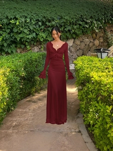 Elegant burgundy V-neck maxi dress with lace trim and tiered bell sleeves for women