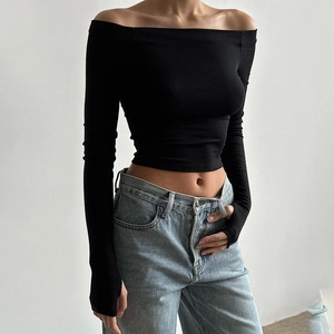 Detail view of black off-the-shoulder slim fit top with long sleeves and thumbholes