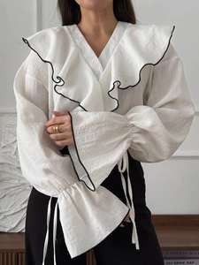 French style white ruffled cardigan blouse with black contrast piping and lantern sleeves