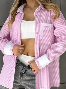 Detailed close-up of pink and white striped shirt with contrasting white collar and cuffs