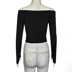 Rear view of slim fit black off-the-shoulder long sleeve top on a white mannequin