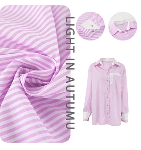 Detail of pink and white vertical stripe shirt with contrasting white collar and pocket