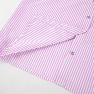 Close-up of fine pink and white stripes fabric with matching purple buttons detail