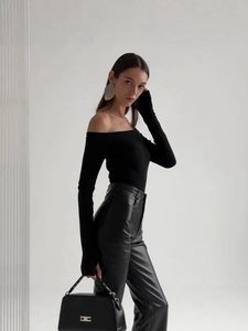 Elegant off-shoulder black long sleeve top paired with sleek high-waisted leather pants