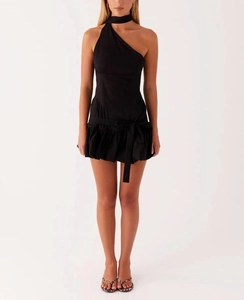 Detail of black off-shoulder mini dress featuring halter scarf and bow belt waist