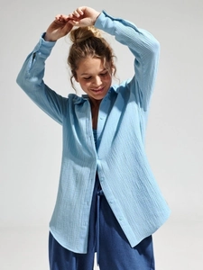Women's light blue cotton crepe button-up shirt with loose fit and textured fabric