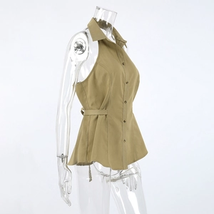 Detail of khaki sleeveless lapel top featuring button-down front and adjustable waist tie