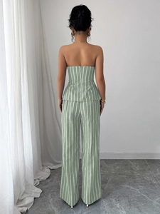 Back view detail of elegant light green striped bandeau top and wide leg pants set