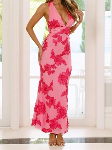 Detail of pink floral halter dress showing deep V-neck and 3D flower embroidery texture