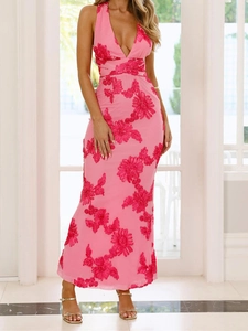 Detail of pink backless maxi dress featuring 3D floral embroidery and a deep V-neckline