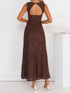 Detail of deep brown floral lace dress featuring elegant backless teardrop cutout