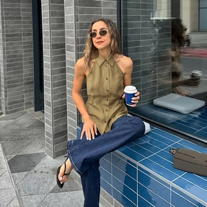 Detail of army green halter neck top with lapel collar and buttons for women