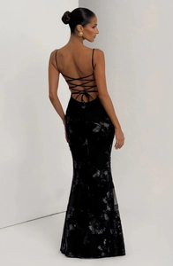 Detail of cross-back straps on black sequin floral dress with silver flower texture
