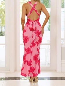 Detail of cross tie back and pink floral embroidery on an elegant backless maxi dress