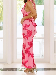Detailed back view of a pink backless dress with 3D floral embroidery and a satin bow