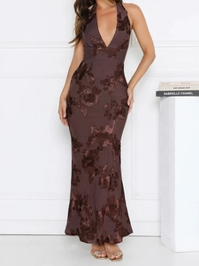 Detail of floral embroidery on deep V-neck halter gown with open back and fishtail hem