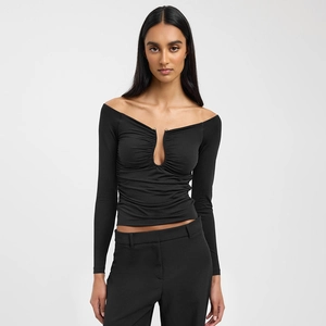 Detail of off-shoulder neckline and U-shaped ruched chest design on black long sleeve top