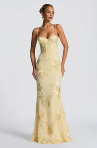 Detail of 3D floral embroidery and corset bodice on a cream tulle fishtail dress