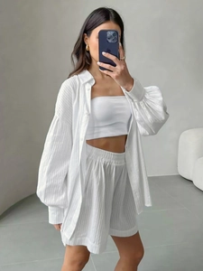 Three-piece white cotton jacquard set with lantern sleeve shirt and high waist shorts