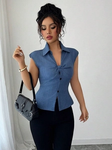 Chic blue sleeveless blouse with knot front detail and decorative buttons on the hem