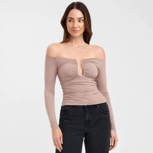 Detail of mauve off-shoulder long sleeve top with front ruching and V-neckline