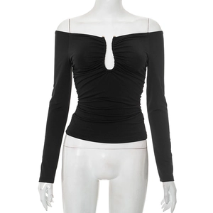 Close-up of black off-shoulder long sleeve top with metal buckle and ruched detailing