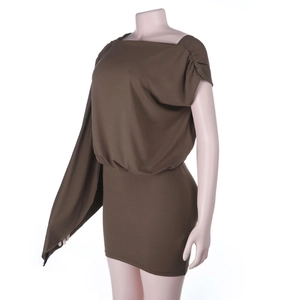 Detail of coffee brown one-shoulder cape dress with side pleats on professional mannequin