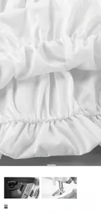 Detailed view of exquisite smocking and fine stitching on a white cotton blouse