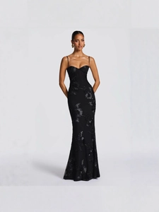 Elegant black mermaid evening dress with floral embroidery and sequins on grey background