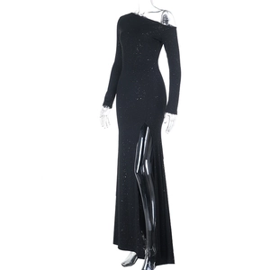Close-up of black glitter evening dress featuring a high side slit and asymmetric neckline