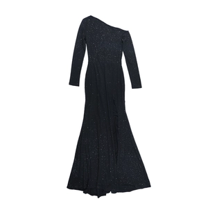 Close-up of black evening dress with shimmering star-like sequins and side slit