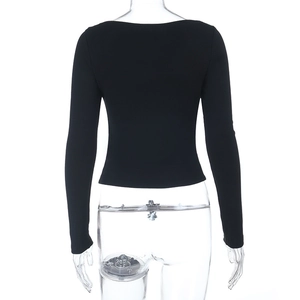 Detailed back view of a slim-fit black long-sleeve lace top with ribbed knit texture